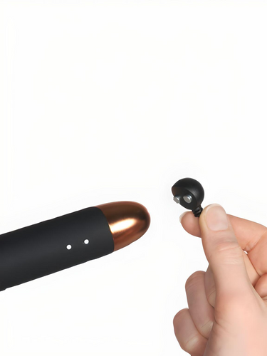 Close-up of the Rocks Off Oriel Ultimate Couples Play Wand Vibrator, demonstrating its magnetic USB charging feature. This wand vibrator combines luxury with practicality for an enhanced intimate experience.